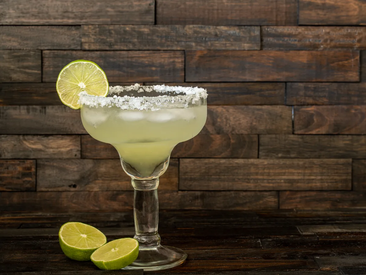 Classic margarita on ice with a salted rim and lime garnish